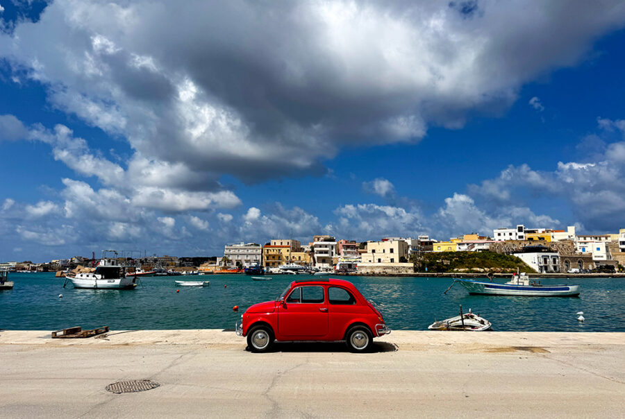 lampedusa dock with red fiat in foreground