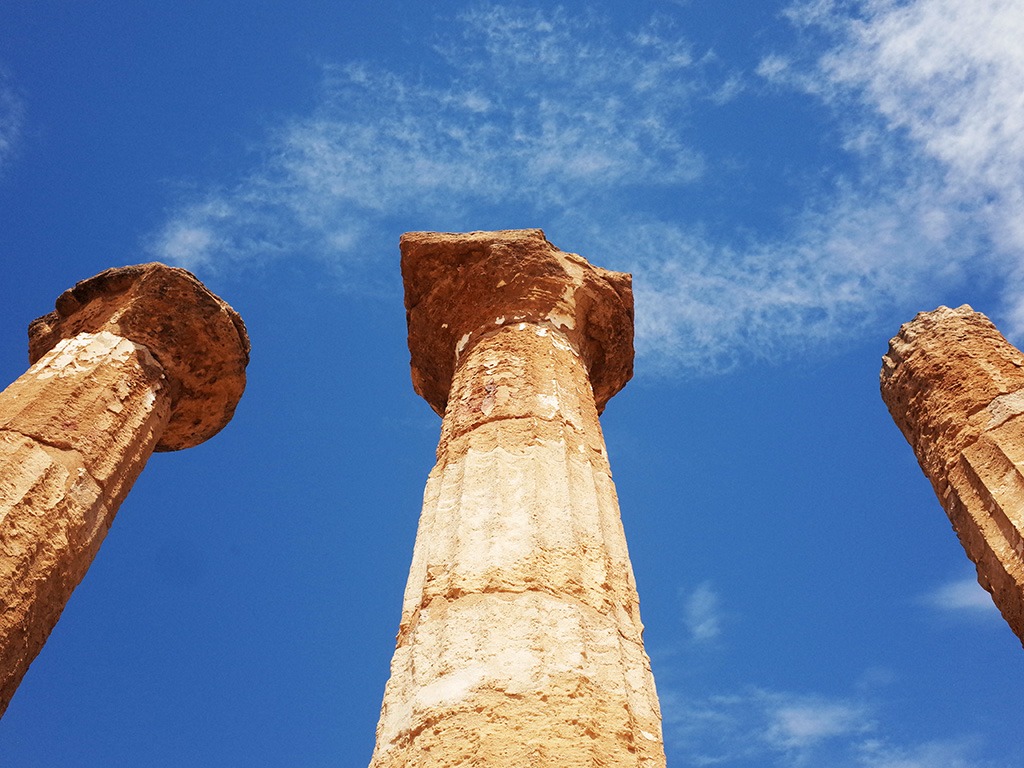 close up view of 3 columns in agrigento valley of the temples
