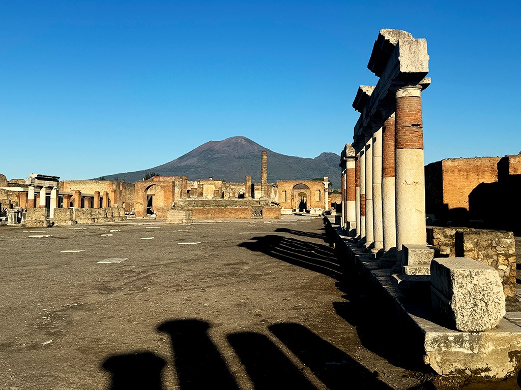 forum of ancient Pompeii site with Vesuvius in the background