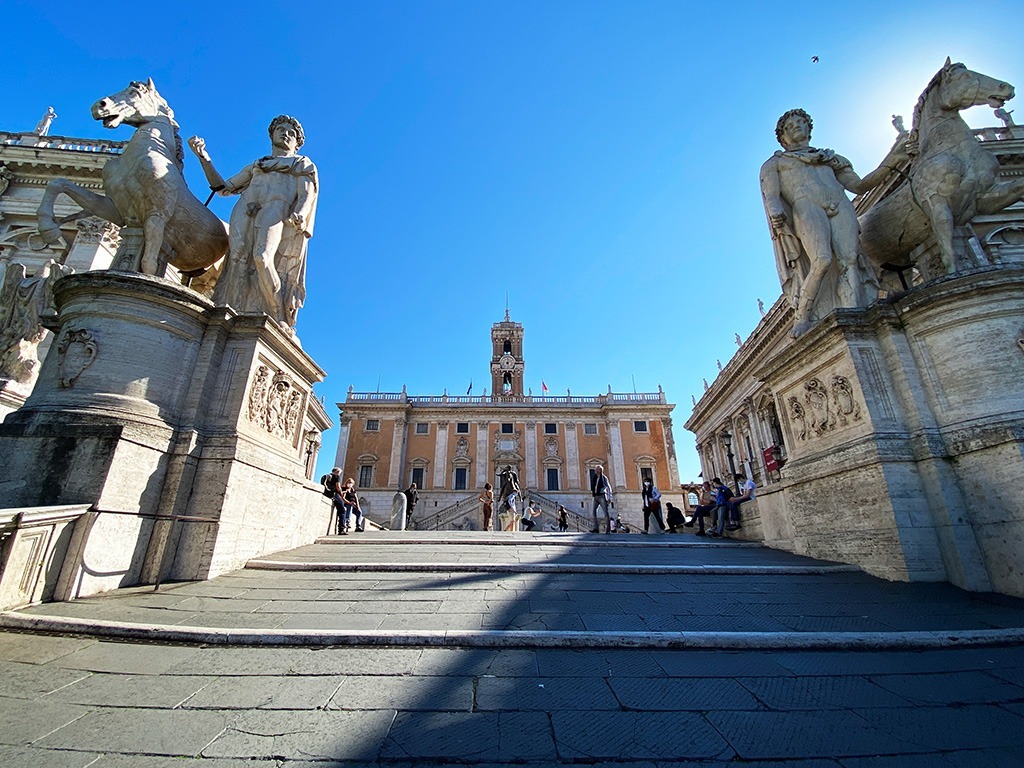 steps up to capitoline hill in rome with blue sunny sky behind