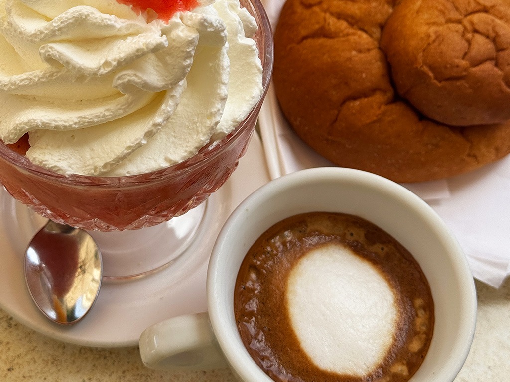 macchiato, brioche and cream-topped granita in a bowl