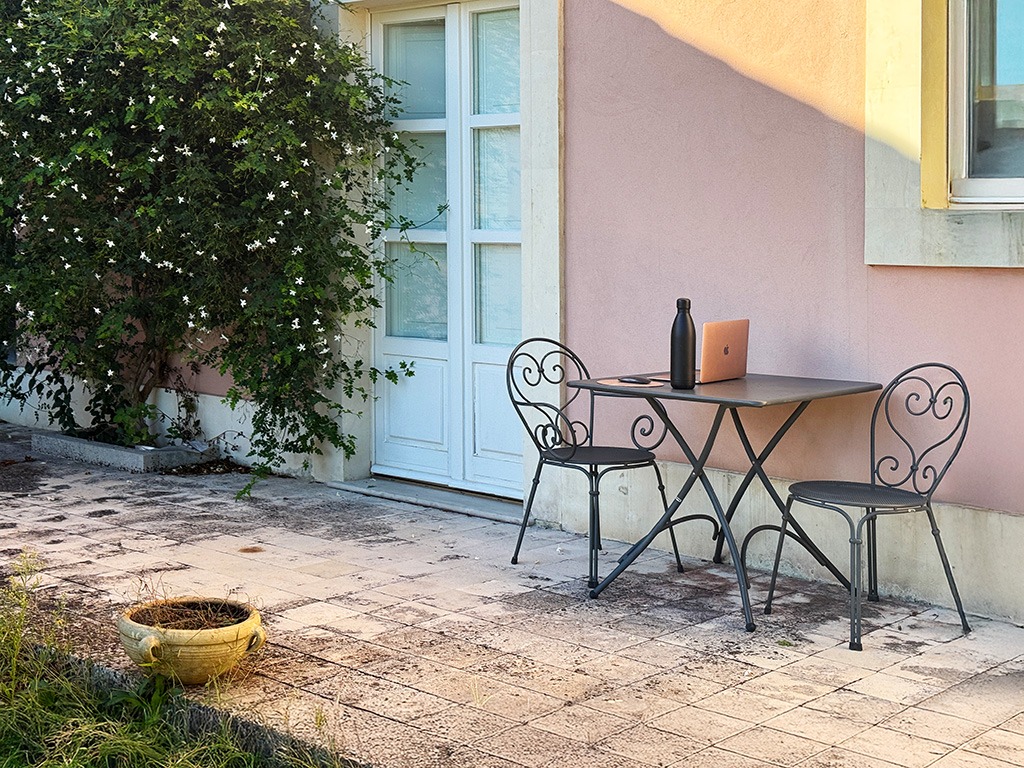 table with laptop on at noto hotel