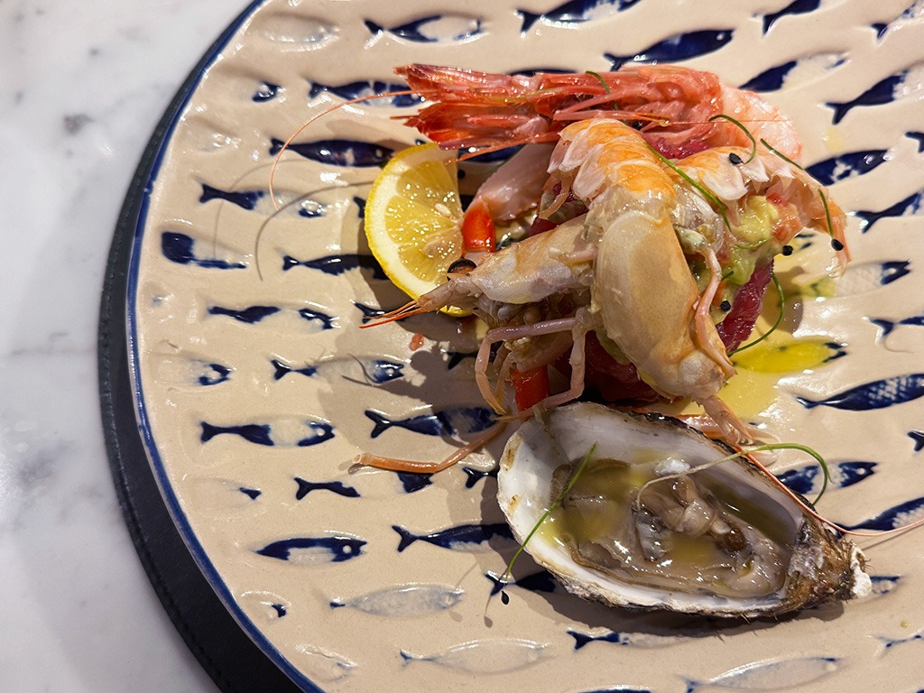 crudo fish on blue and white plate