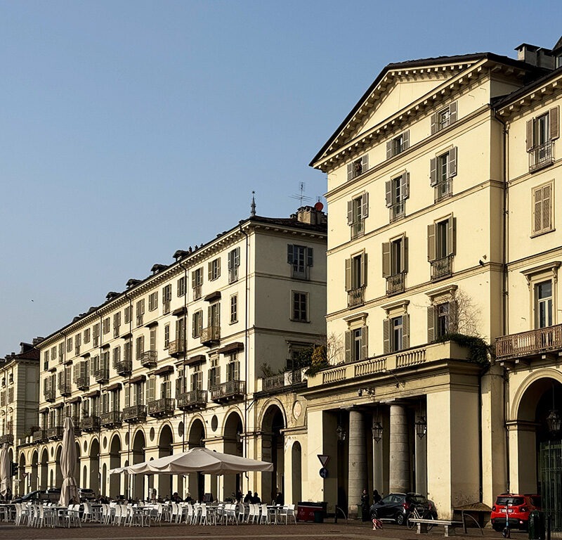white tables and chairs in piazza vittorio veneto turin