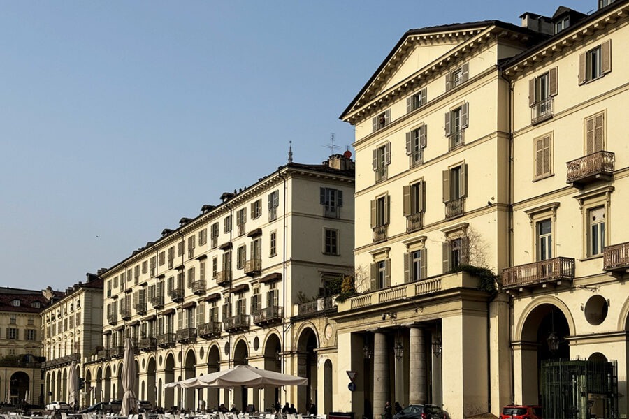 white tables and chairs in piazza vittorio veneto turin