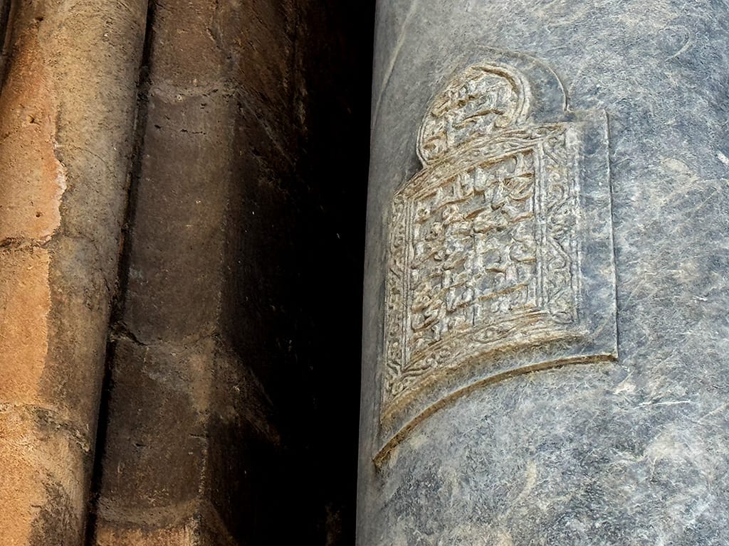 close up of quran verse in Arabic text on column of palermo cathedral