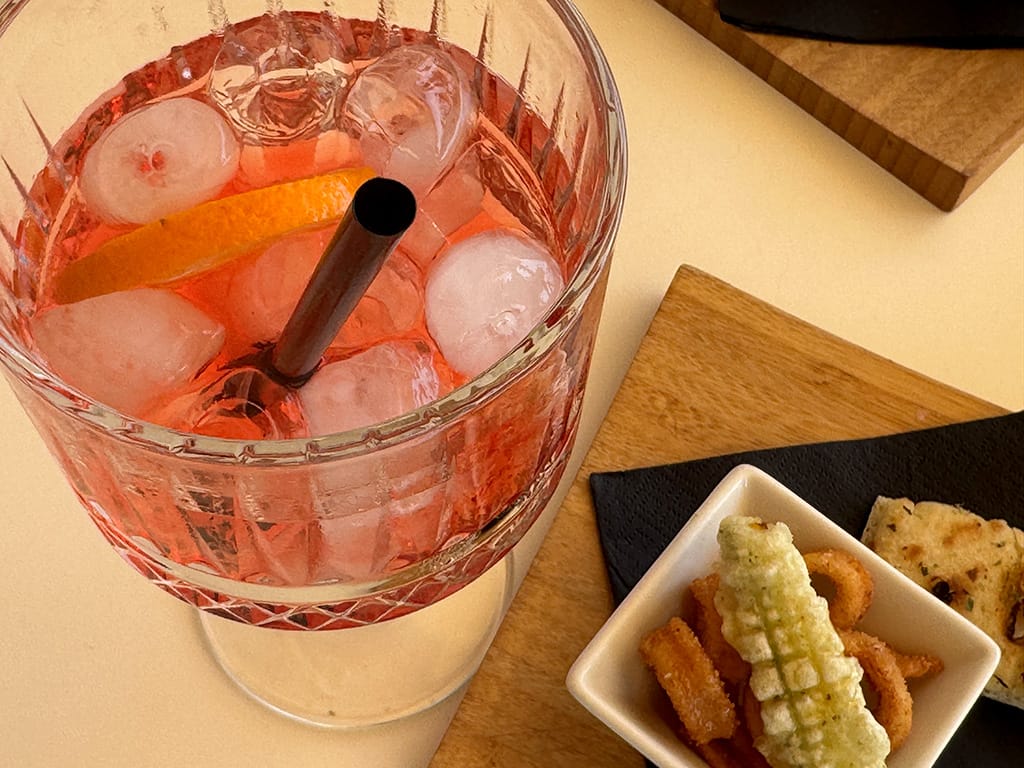 spritz glass and fried fish tapas