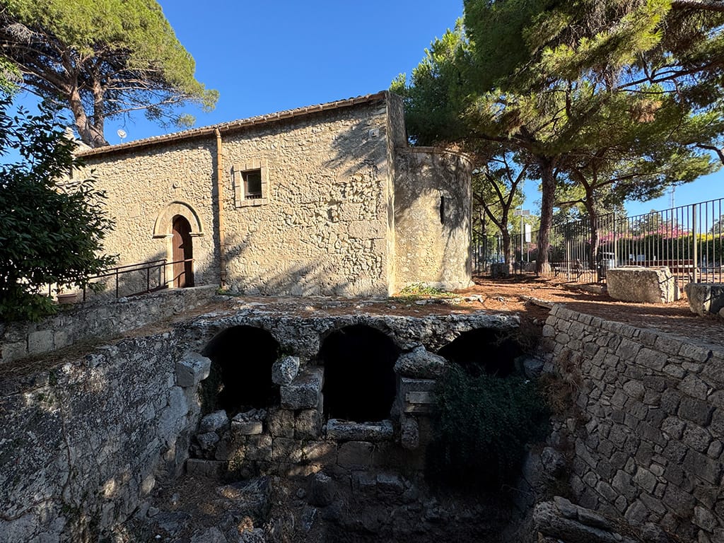 side of medieval church with ancient roman cistern arches underneath