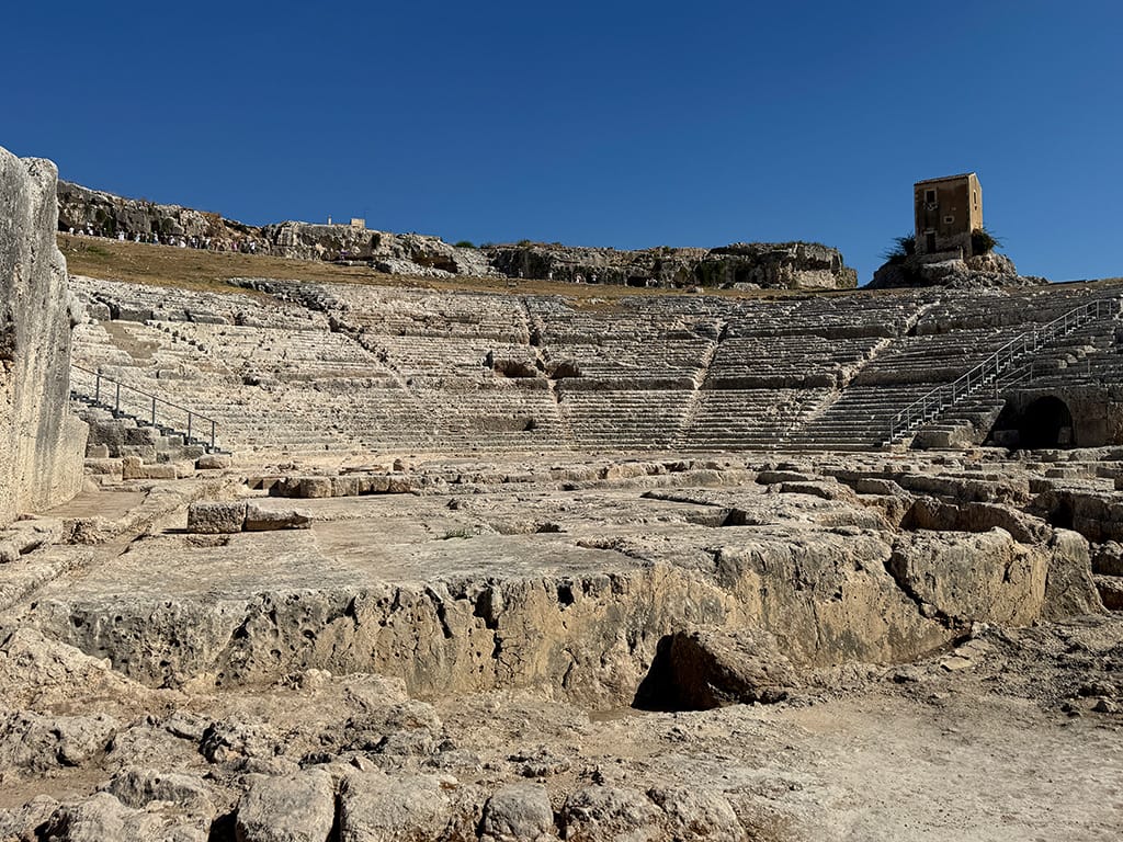 view of ancient greek theatre looking up at seating